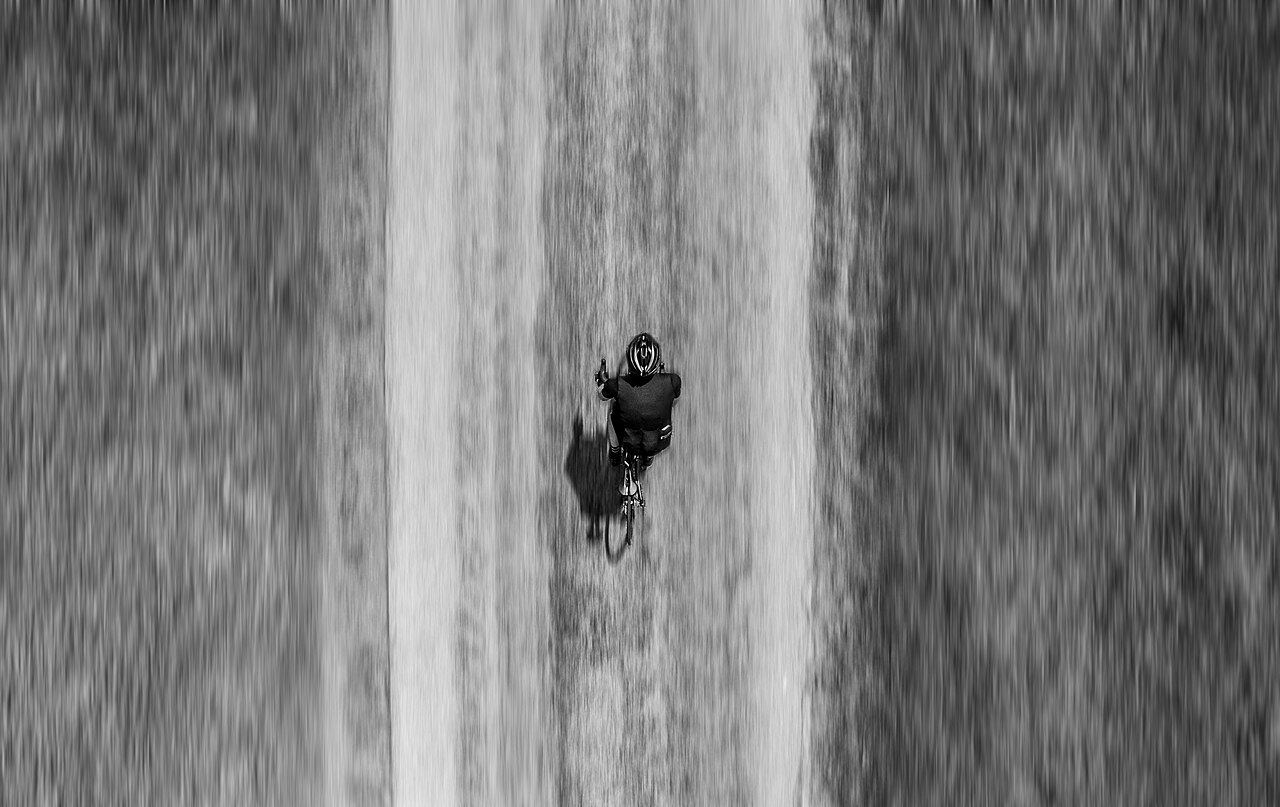 A cyclist is a real system with forces and changing motion